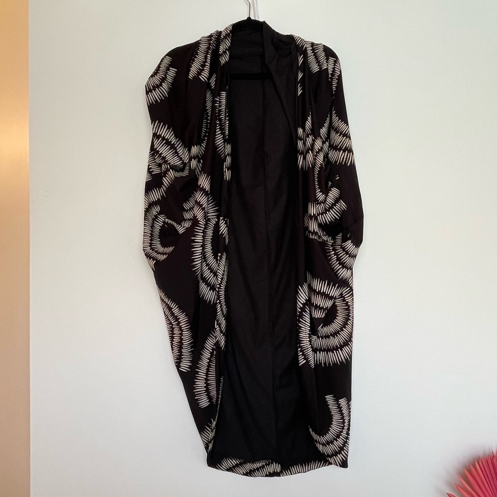 Matthildur black print large Pima Lycra blossom cape cardigan mini length